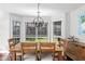 Bright dining room with large windows offering ample natural light and backyard views at 503 Stanford Pl, Woodstock, GA 30188