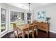 Charming dining area with large windows offering ample natural light and backyard views at 503 Stanford Pl, Woodstock, GA 30188