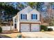 Charming two-story home featuring a brick-accented two-car garage and well-maintained landscaping at 503 Stanford Pl, Woodstock, GA 30188