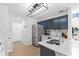 Modern kitchen featuring stainless steel appliances, white countertops, and stylish cabinetry at 503 Stanford Pl, Woodstock, GA 30188