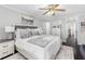 Spacious main bedroom with dark hardwood floors, neutral colors, and a large plush bed at 503 Stanford Pl, Woodstock, GA 30188