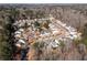 Overhead view of a residential area with winding roads, cul-de-sacs, and mature trees surrounding the homes at 503 Stanford Pl, Woodstock, GA 30188