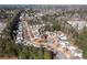 Aerial view of a neighborhood featuring winding roads lined with beautiful, well-maintained homes at 503 Stanford Pl, Woodstock, GA 30188