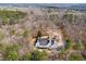 Aerial view of a private estate surrounded by a dense forest, showcasing the property's seclusion at 5515 Punkintown Rd, Douglasville, GA 30135