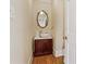 Charming powder room with a vessel sink, ornate mirror, and hardwood floors at 5515 Punkintown Rd, Douglasville, GA 30135