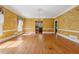 Elegant dining room featuring hardwood floors and a sparkling chandelier at 5515 Punkintown Rd, Douglasville, GA 30135