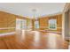 Formal dining room with hardwood floors, chandelier, and elegant wall texture at 5515 Punkintown Rd, Douglasville, GA 30135