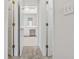 Hallway view leading to the bright and airy home office with neutral tones, offering a quiet workspace at 5515 Punkintown Rd, Douglasville, GA 30135