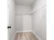 Walk-in closet with carpeted flooring and wire shelving for organized storage at 196 Wingo St, Norcross, GA 30071