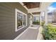 Inviting front porch with ceiling fan, offering a perfect spot to unwind and enjoy the outdoors at 196 Wingo St, Norcross, GA 30071