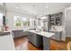 Well-equipped kitchen featuring white countertops, gray cabinets, stainless steel appliances, and a central island at 196 Wingo St, Norcross, GA 30071