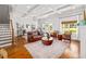 Bright living room featuring hardwood floors, coffered ceilings, and a stylish seating arrangement at 196 Wingo St, Norcross, GA 30071