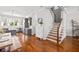 Bright living room with hardwood floors, modern kitchen, and staircase at 196 Wingo St, Norcross, GA 30071