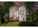 An angle view of this white two story home highlighting the deck with wooden stairs at 2453 Paul Nw Ave, Atlanta, GA 30318