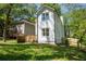 An angle view of this white two story home highlighting the fence line and backyard at 2453 Paul Nw Ave, Atlanta, GA 30318