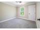 Bedroom with neutral-toned walls, carpet flooring, and crown molding at 2453 Paul Nw Ave, Atlanta, GA 30318