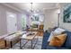 Open-concept living room with a fireplace, and hardwood floors, bathed in natural light at 2453 Paul Nw Ave, Atlanta, GA 30318