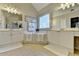 Bright bathroom featuring double sinks, soaking tub, and modern fixtures at 5030 New Chapel Hill Way, Cumming, GA 30041