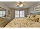 Comfortable bedroom featuring a queen-sized bed, soft lighting, and a matching dresser at 5030 New Chapel Hill Way, Cumming, GA 30041