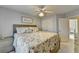 Relaxing bedroom featuring a queen bed, a ceiling fan, and a matching dresser at 5030 New Chapel Hill Way, Cumming, GA 30041