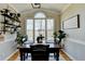 Sunlit breakfast nook featuring a classic wooden table and views of the backyard at 5030 New Chapel Hill Way, Cumming, GA 30041