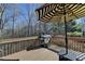 Outdoor deck area with a grill and striped sun umbrella at 5030 New Chapel Hill Way, Cumming, GA 30041