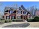 Beautiful brick house with black shutters and mature landscaping at 5030 New Chapel Hill Way, Cumming, GA 30041