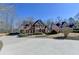 Traditional brick home featuring a well-manicured lawn and a long drive at 5030 New Chapel Hill Way, Cumming, GA 30041