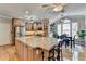 Bright kitchen with a large island, modern stainless steel appliances, and a dining area at 5030 New Chapel Hill Way, Cumming, GA 30041