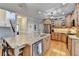 Kitchen with stainless appliances and large granite island at 5030 New Chapel Hill Way, Cumming, GA 30041