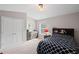 Comfortable bedroom featuring neutral carpet, a dresser, and a bed with a patterned cover at 5975 Vista Brook Dr, Suwanee, GA 30024