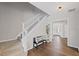 Entryway features staircase and bench with pillows in a neutrally decorated home at 5975 Vista Brook Dr, Suwanee, GA 30024