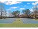 Community tennis courts with lighting for evening games at 5975 Vista Brook Dr, Suwanee, GA 30024