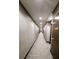 Long, neutral-toned hallway with carpet and recessed lighting, leading to various doors at 855 Peachtree Ne St # 2309, Atlanta, GA 30308