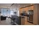 Modern kitchen featuring stainless steel appliances, a breakfast bar, and ample natural light from large windows at 855 Peachtree Ne St # 2309, Atlanta, GA 30308