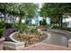 Lush landscaped outdoor area with stone accents, walkway, plantings, and fountain for tranquil enjoyment at 855 Peachtree Ne St # 2309, Atlanta, GA 30308