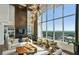 Bright living room with floor-to-ceiling windows offering amazing city views at 855 Peachtree Ne St # 2309, Atlanta, GA 30308