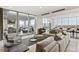 Spacious living room with stylish furniture and floor-to-ceiling windows at 855 Peachtree Ne St # 2309, Atlanta, GA 30308