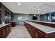 Modern lounge area with sleek cabinetry, quartz countertop, and a TV above the sink at 855 Peachtree Ne St # 2309, Atlanta, GA 30308