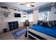 Well-lit bedroom with a ceiling fan, desk, and a comfortable bed, perfect for relaxation and study at 1061 Steeple Run, Lawrenceville, GA 30043