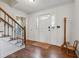 Bright foyer with hardwood floors and a white front door with sidelights at 1061 Steeple Run, Lawrenceville, GA 30043