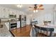 Bright eat-in kitchen features stainless steel appliances and ample counter space at 1061 Steeple Run, Lawrenceville, GA 30043