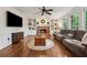Bright living room with hardwood floors, fireplace, and built-in shelves for storage at 1061 Steeple Run, Lawrenceville, GA 30043