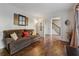 Comfortable living room showcasing hardwood flooring and comfortable seating arrangement at 1061 Steeple Run, Lawrenceville, GA 30043