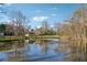 Enjoy the beauty of the expansive pond with mature trees offering tranquil views from this property at 1061 Steeple Run, Lawrenceville, GA 30043