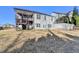 Spacious backyard featuring a walk-out patio and deck, ideal for outdoor entertaining and relaxation at 1431 Torrington Dr, Auburn, GA 30011