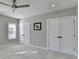 Neutral bedroom featuring a ceiling fan, and double closets offer lots of storage space at 1431 Torrington Dr, Auburn, GA 30011