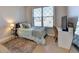 Comfortable bedroom with natural light, cozy rug, and a stylish desk area at 1431 Torrington Dr, Auburn, GA 30011