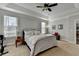 Relaxing bedroom with tray ceiling, two sunny windows, carpet flooring, and neutral walls for a serene atmosphere at 1431 Torrington Dr, Auburn, GA 30011