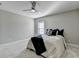 Comfortable bedroom with neutral decor, a ceiling fan, and soft carpeting at 1431 Torrington Dr, Auburn, GA 30011